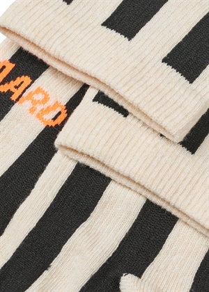 Antonella single sock Black/Vanilla Ice Mads Nørgaard